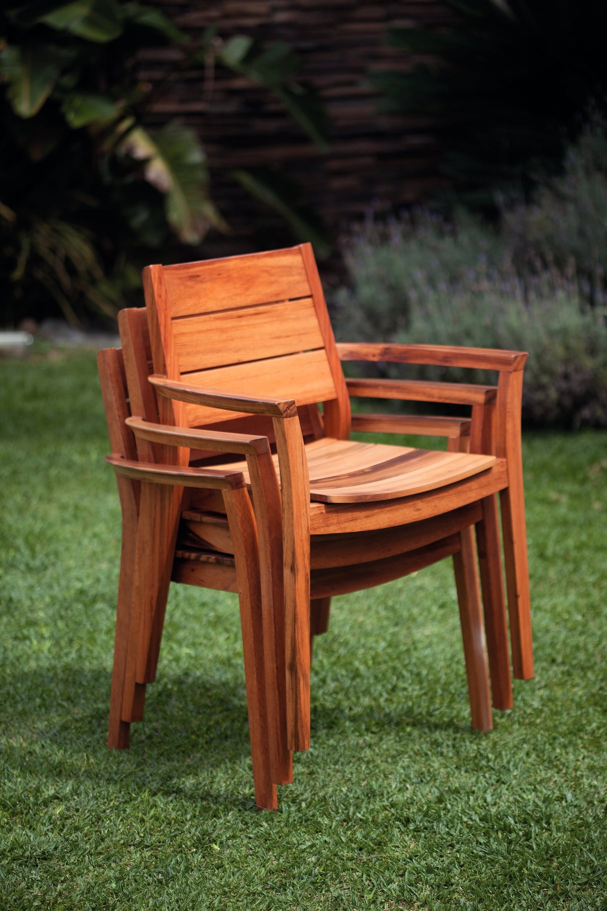 Tramontina Muiracatiara Wood Stackable Lounge Chair with Eco Clear Finish and Armrests