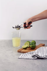 Tramontina Utilità Stainless-Steel Lemon Squeezer with Black Polypropylene Handle
